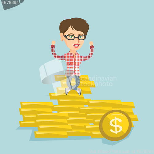 Image of Happy business woman sitting on golden coins.