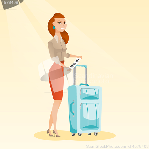 Image of Caucasian business woman showing luggage tag.
