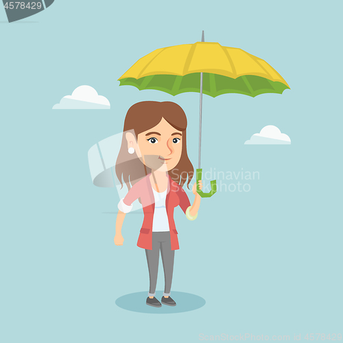 Image of Caucasian insurance agent standing under umbrella.