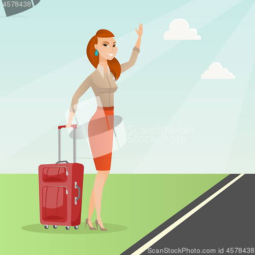 Image of Young caucasian woman with suitcase hitchhiking.