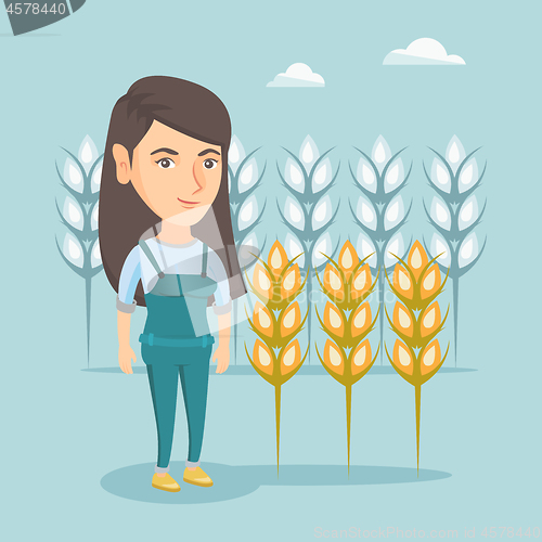 Image of Young caucasian farmer standing in a wheat field.