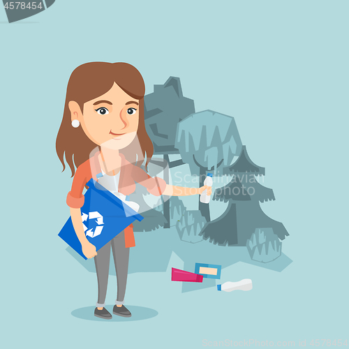 Image of Caucasian woman collecting garbage in the forest.