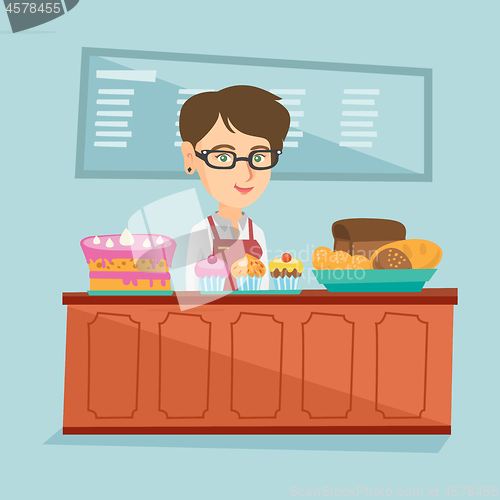 Image of Worker standing behind the counter in the bakery.