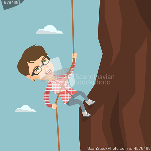 Image of Caucasian business woman climbing the mountain.