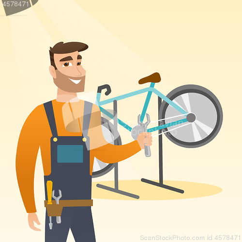 Image of Caucasian bicycle mechanic working in repair shop.