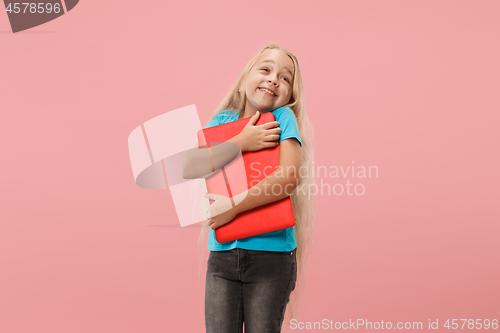 Image of The happy child with red laptop on pink