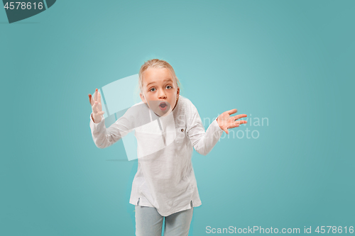 Image of Beautiful female half-length portrait on studio backgroud. The young emotional teen girl