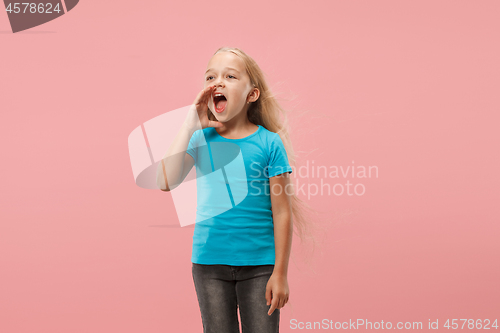 Image of Isolated on pink young casual teen girl shouting at studio