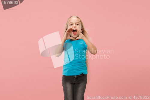 Image of Isolated on pink young casual teen girl shouting at studio