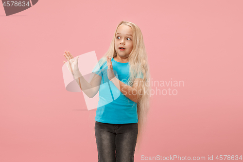 Image of Portrait of the scared girl on pink