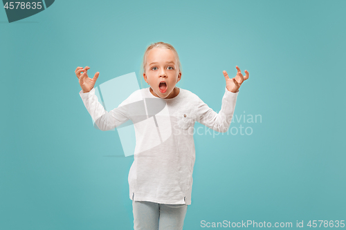 Image of Beautiful female half-length portrait on studio backgroud. The young emotional teen girl