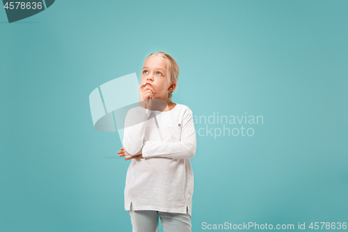 Image of Young serious thoughtful teen girl. Doubt concept.