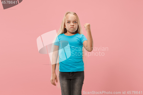 Image of Portrait of angry teen girl on a studio background
