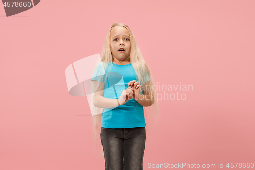 Image of Portrait of the scared girl on pink