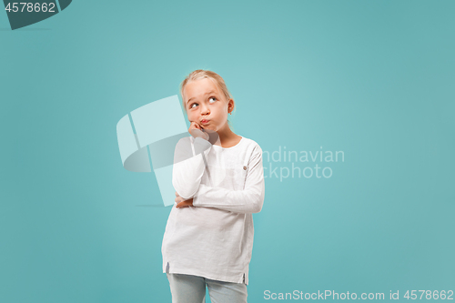 Image of Young serious thoughtful teen girl. Doubt concept.