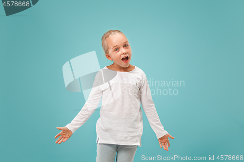 Image of Beautiful female half-length portrait on studio backgroud. The young emotional teen girl