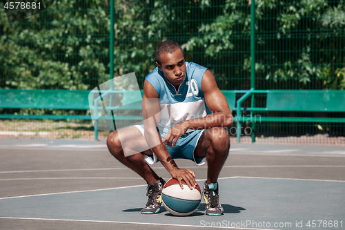 Image of Picture of young resting african basketball player
