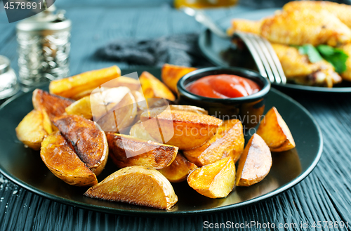 Image of potato with chicken wings