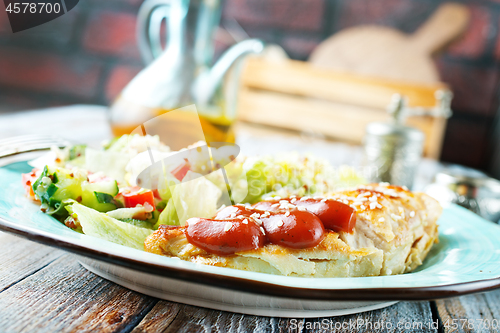 Image of fried chicken breast and salad