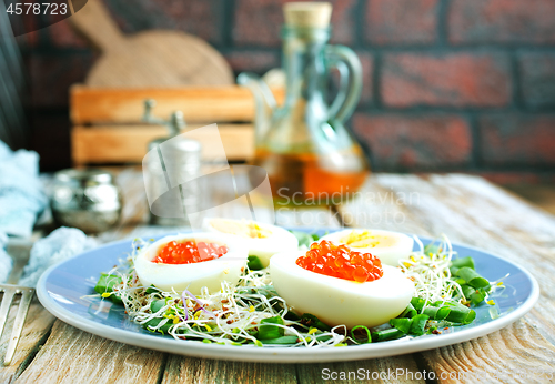 Image of eggs with red salmon caviar