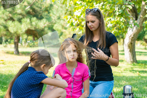 Image of Girl can not comb the hair of a child