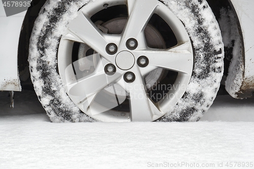 Image of Car tyre in snow