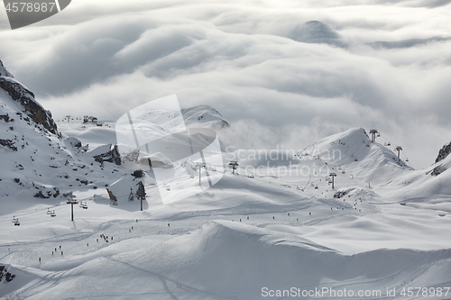 Image of Snowy skiing slopes from the top