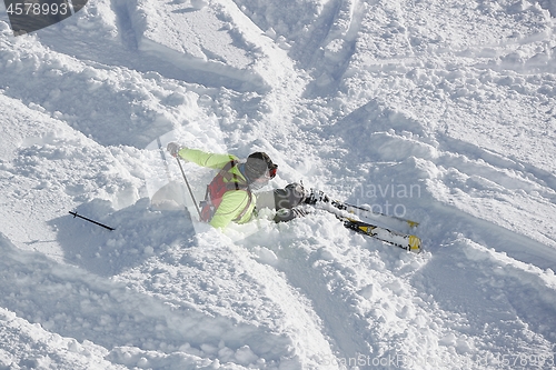 Image of Skier falls in deep snow