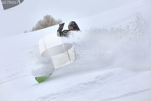 Image of Snowboarding in fresh powder snow