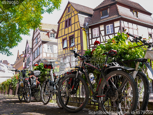 Image of House facade with flowers and bicycles in Alsace, France