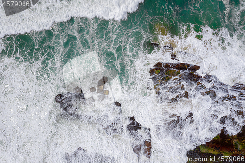 Image of Overhead wave action over coastal rocks