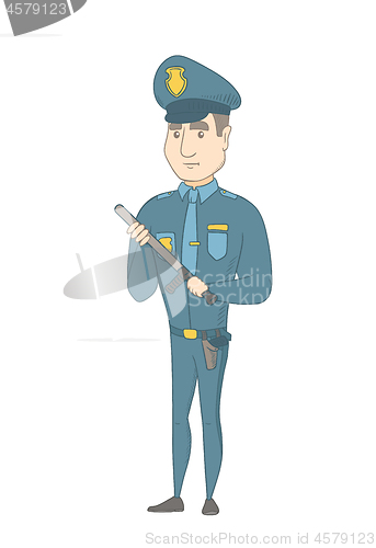 Image of Young serious caucasian policeman with baton.