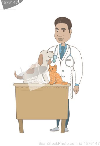 Image of Young hispanic veterinarian examining pets.