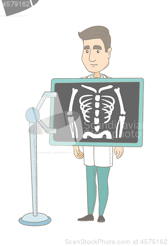 Image of Caucasian roentgenologist during x ray procedure.