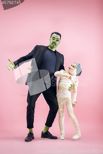 Image of Halloween Family. Happy Father and Children Girl in Halloween Costume and Makeup