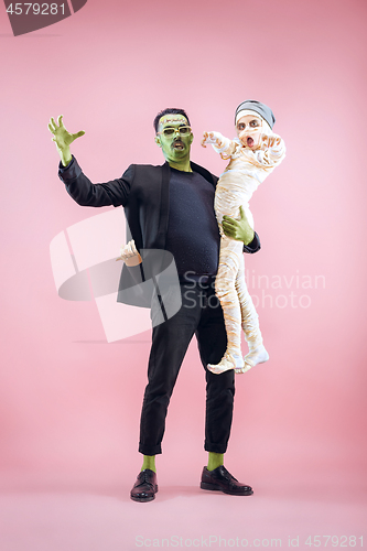 Image of Halloween Family. Happy Father and Children Girl in Halloween Costume and Makeup