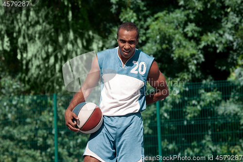 Image of Picture of young resting african basketball player