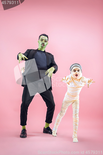 Image of Halloween Family. Happy Father and Children Girl in Halloween Costume and Makeup