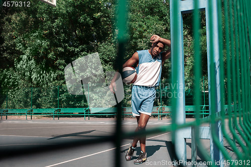 Image of Picture of young resting african basketball player