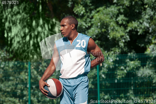 Image of Picture of young resting african basketball player