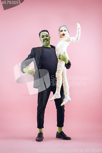 Image of Halloween Family. Happy Father and Children Girl in Halloween Costume and Makeup