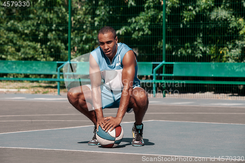 Image of Picture of young resting african basketball player