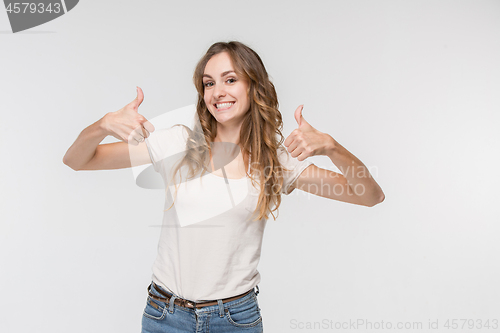 Image of The happy business woman standing and smiling against white background.