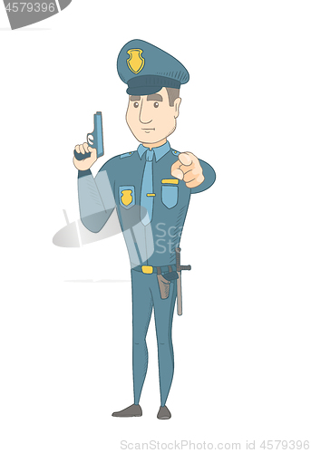 Image of Young caucasian policeman holding a handgun.