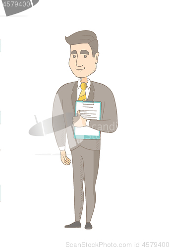 Image of Businessman holding clipboard with documents.