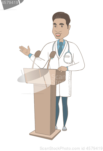 Image of Hispanic doctor giving a speech from tribune.