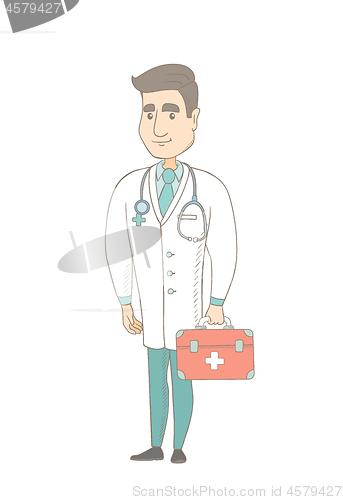 Image of Young caucasian doctor holding first aid box.