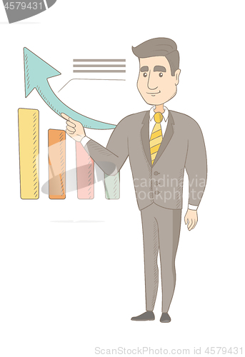 Image of Young caucasian businessman pointing at chart.