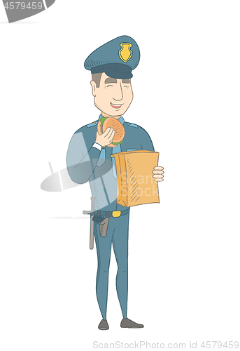 Image of Young caucasian police officer eating hamburger.