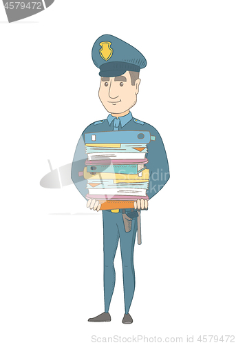 Image of Young caucasian policeman holding pile of folders.